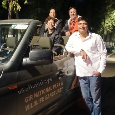 Travelers spotting Asiatic lions during a morning safari in Gir National Park